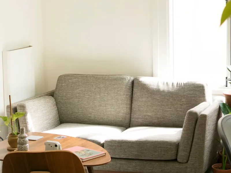 Clean floor edge and wall baseboard in sunny apartment room