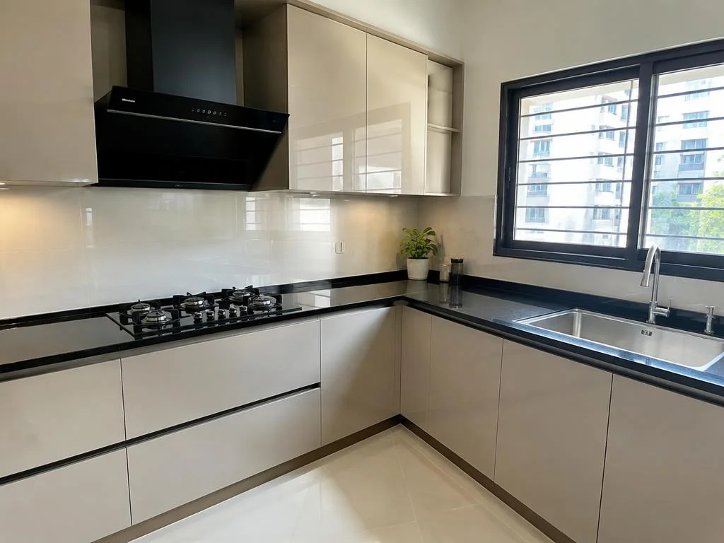 Clean modular kitchen countertop, sink, and backsplash tiles
